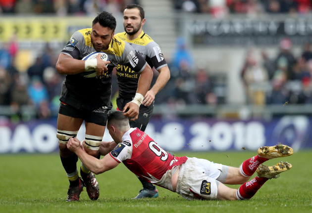 Victor Vito is tackled by John Cooney