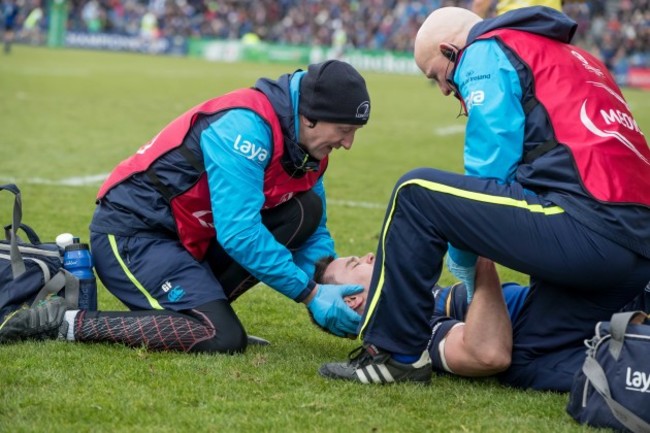 Johnny Sexton receives attention after scoring a try