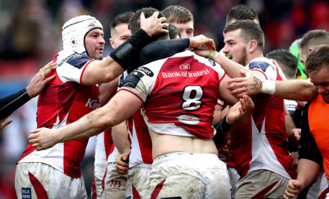 Nick Timoney celebrates his try with teammates