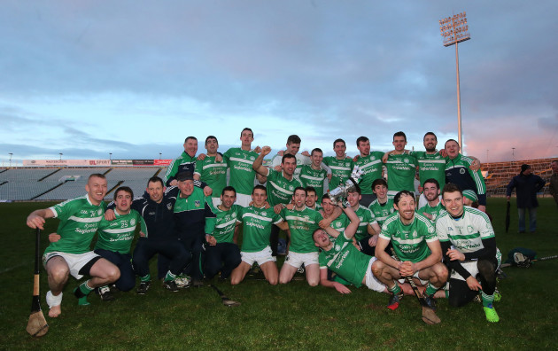 Kilmallock team celebrate with the trophy after the game
