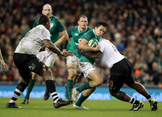 Joey Carbery is tackled by Peni Ravai