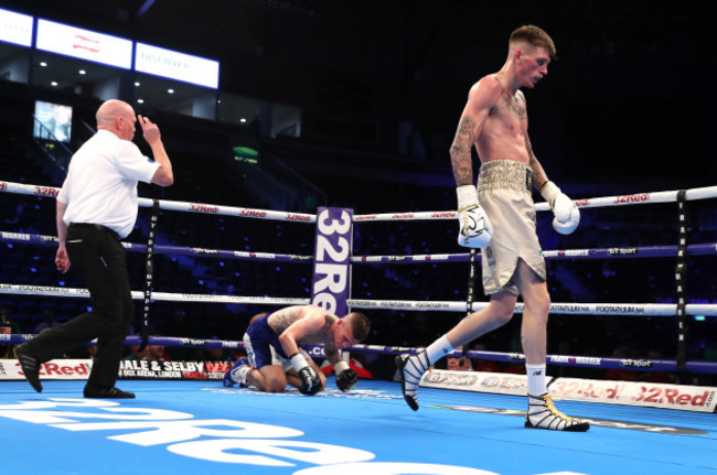 Gary Cully (right) walks away after Kane Baker is floored