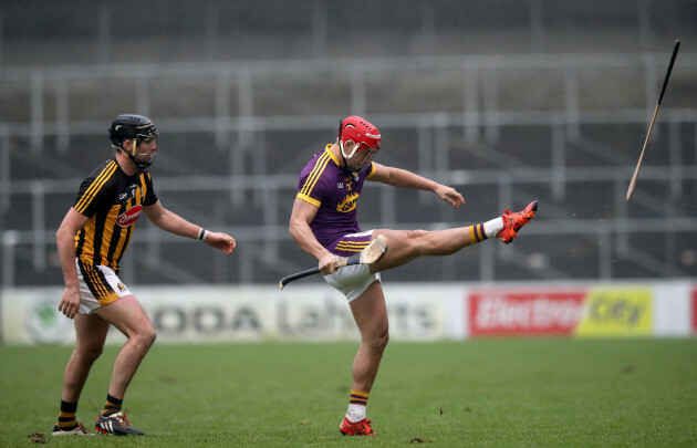 Lee Chin kicks Conor O'Shea's hurl out of play