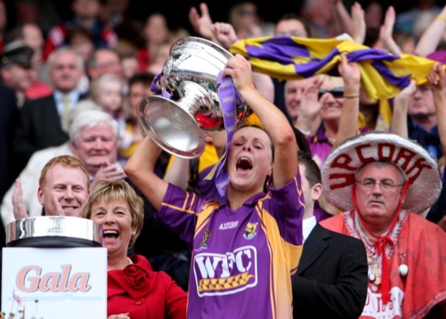 Mary Leacy lifts the cup