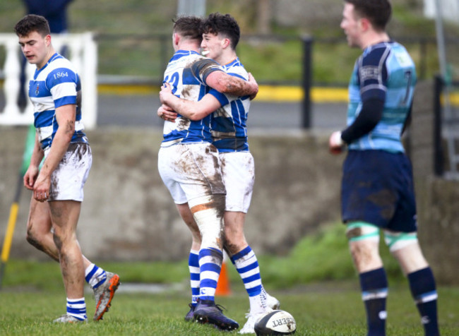 Dylan Farrelly celebrates scoring their second try with Andrew Daly