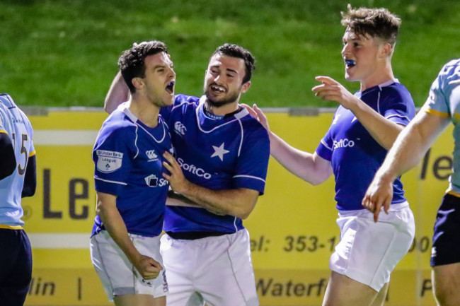 Dave Fanagan celebrates his try with teammates