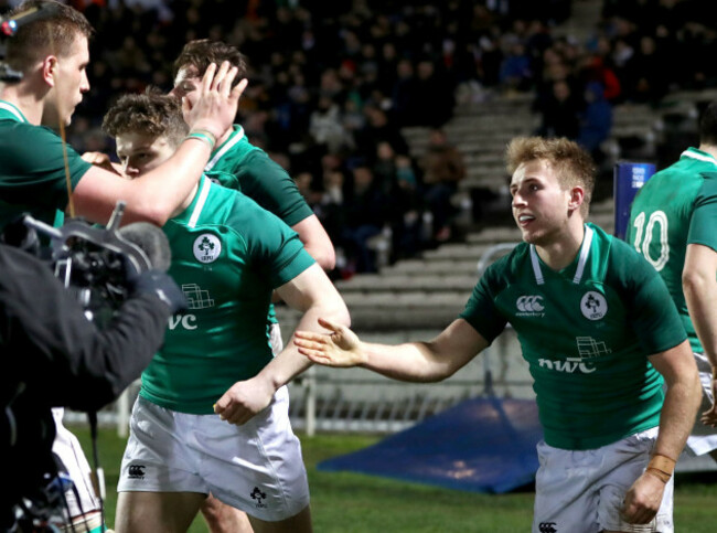 Jonny Stewart celebrates scoring a try with teammates