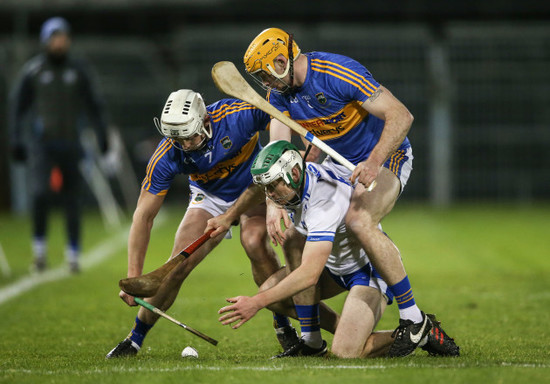 Mark O'Brien under pressure rom Padraic Maher and Ronan Maher