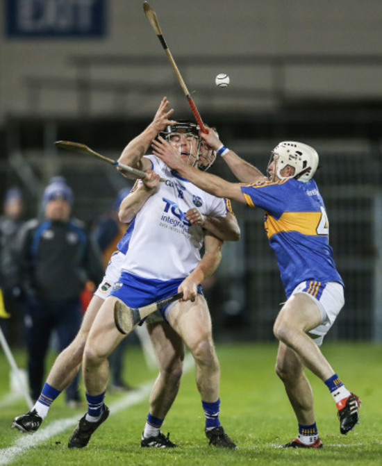 Brendan Maher and Sean O'Brien tackle Kevin Moran