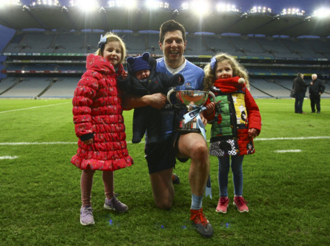 Sean Cavanagh poses with his kids Clara, Sean and Eva at the end of the game