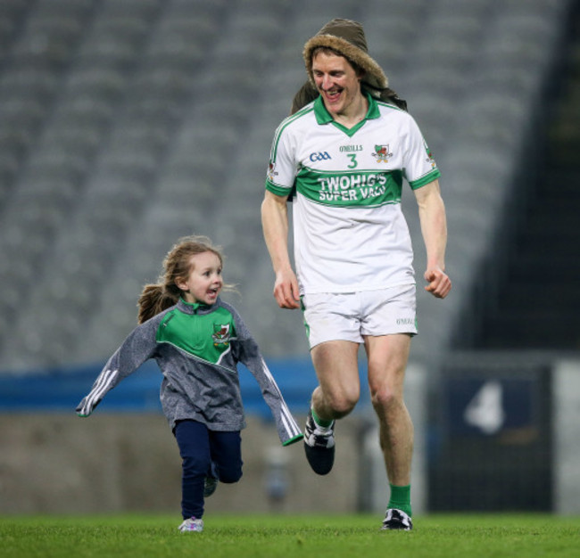 John McLoughlin celebrates with his niece Caoimhe after the game