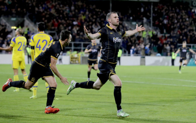 Ciaran Kilduff celebrates scoring a goal with Robbie Benson