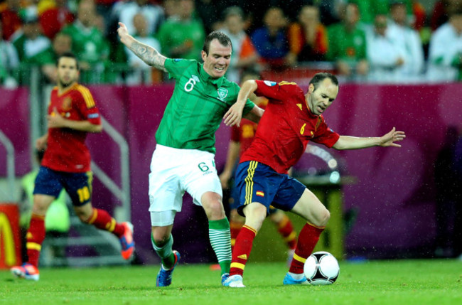 Glenn Whelan and Andres Iniesta