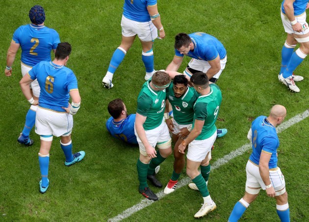 Bundee Aki celebrates scoring their third try with Dan Leavy and Conor Murray