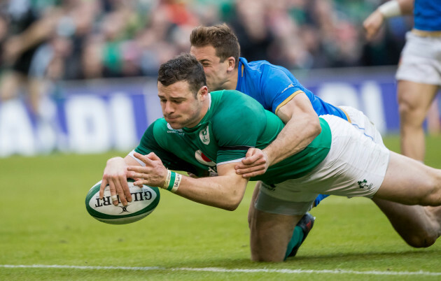 Robbie Henshaw scores their fifth try despite the efforts of Tommaso Benvenuti