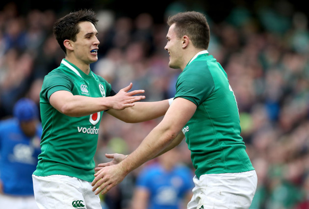 Jacob Stockdale celebrates scoring his sides seventh try with Joey Carbery