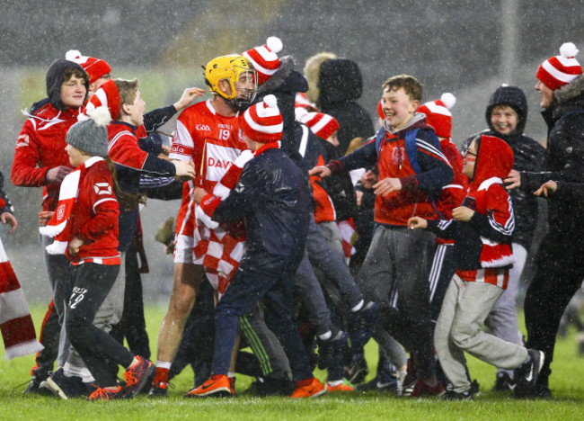 Cuala's supporters celebrate with Cian Waldron at the end of the game