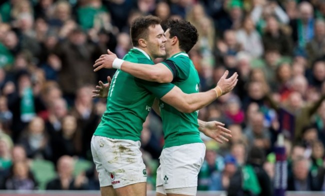 Jacob Stockdale celebrates scoring their seventh try with Joey Carbery