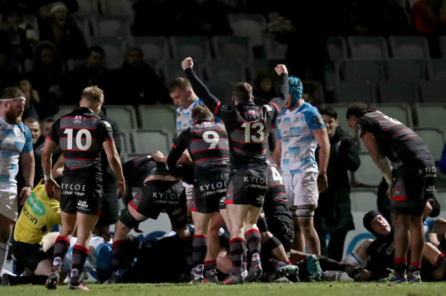 Edinburgh players celebrate Murray McCallum's try