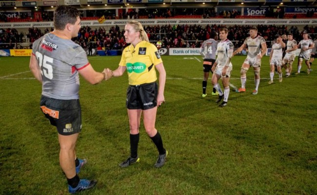 Players shake hands with Joy Neville after the game