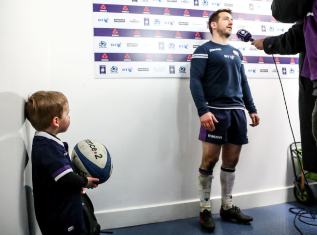 Greig Laidlaw son Ruary look on as his father is interviewed after the game