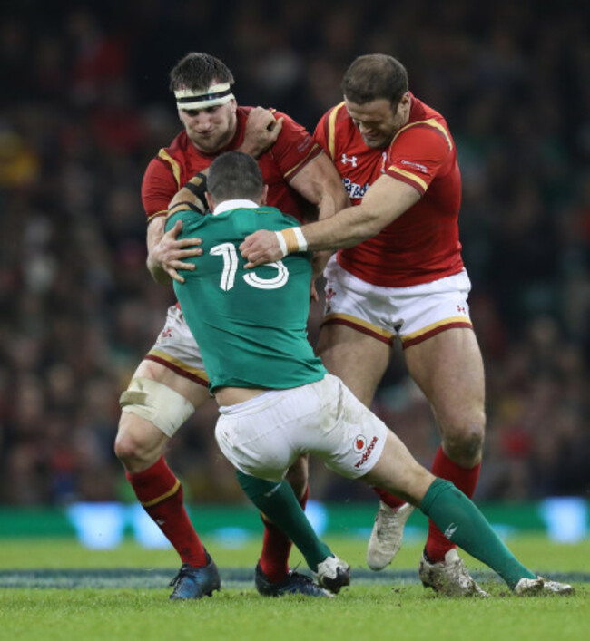 Ireland&rsquo;s Rob Kearney is tackled by Wales Sam Warburton and Jamie Roberts