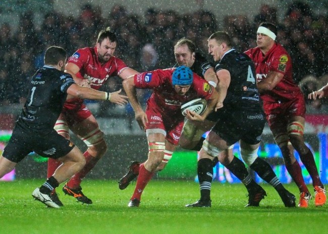 Tadhg Beirne is tackled by Alun Wyn Jones