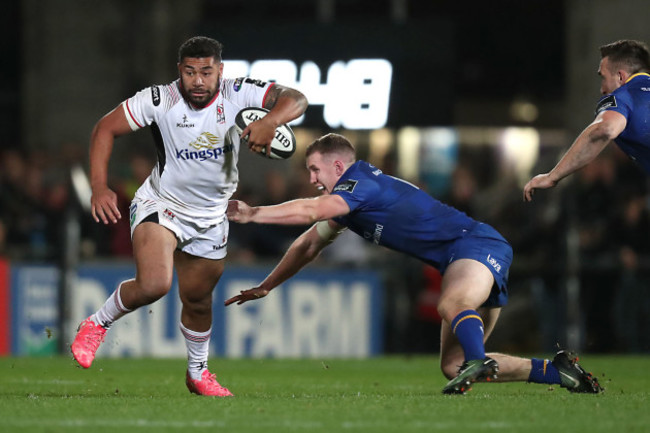 Charles Piutau skips by Rory O'Loughlin