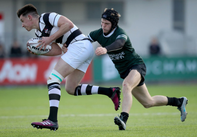 Jamie O'Grady is tackled by Con Creedon