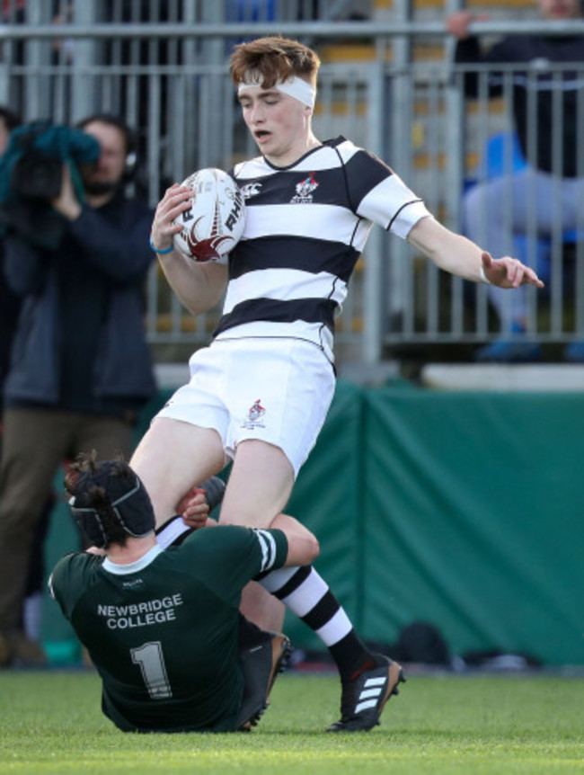 Alistair Loughrey is tackled by Thomas Grant