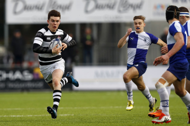 Belvedere College's Hugh O&rsquo;Sullivan charges at the St Andrew&rsquo;s College defence