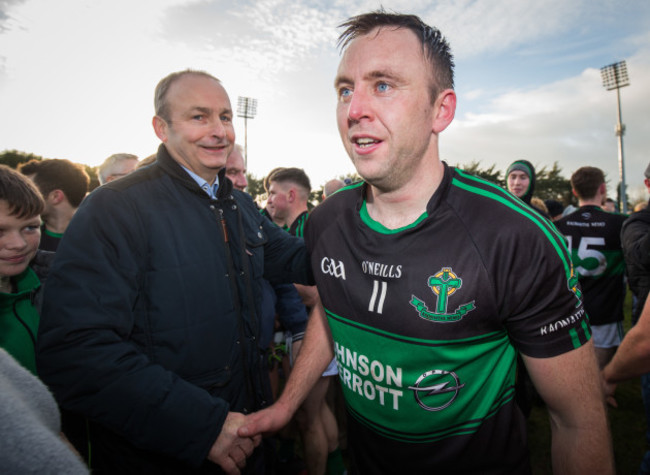 Paul Kerrigan shakes hands with Micheal Martin TD after the game