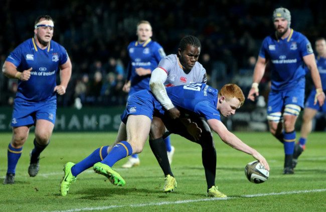 Ciaran Frawley scores his side's fifth try despite the efforts Yaw Penxe