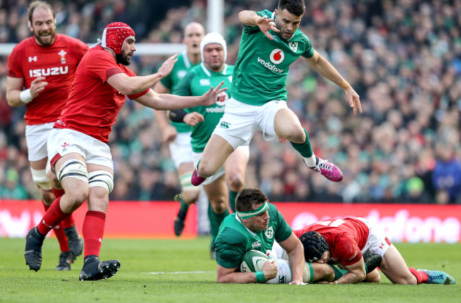 Conor Murray jumps CJ Stander as he's tackled by Leigh Halfpenny