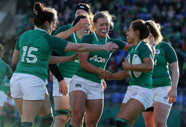 Sene Naoupu celebrates her try with teammates