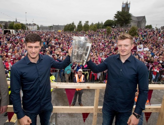 David Burke and Joe Canning show the Liam McCarthy Cup to the crowd in Ballinasloe