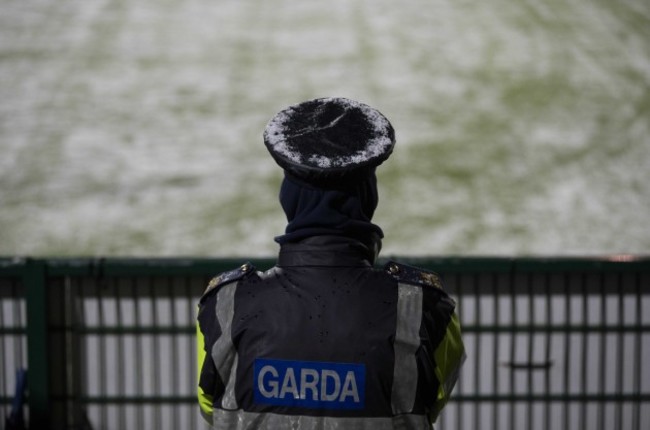 A Garda with a snow covered hat during the game