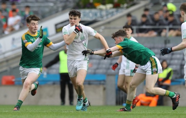 Rory O'Connor tackled by Lorcan McMonagle and Dara Moynihan