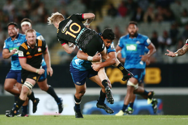 Damian McKenzie tackled by Rieko Ioane