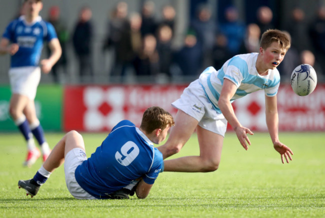 Adam McEvoy tackles Stephen Madigan