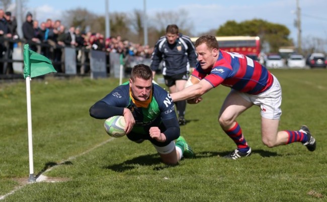 Rodger McBurney scores a try despite Robert Keogh