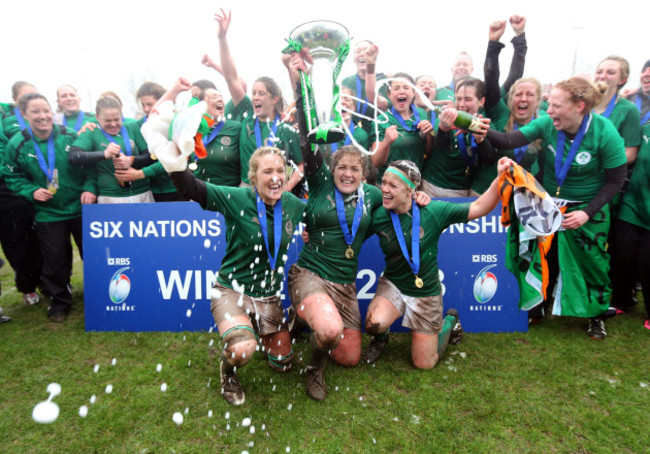 Joy Neville, Fiona Coghlan and Lynne Cantwell lift the cup