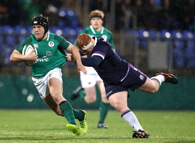 Angus Curtis tackled by Robbie Smith