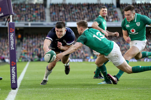 Blair Kinghorn scores their first try despite Garry Ringrose