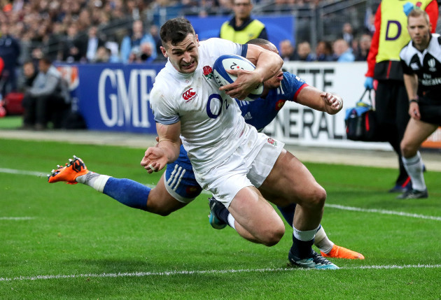 Jonny May scores his sides first try despite the efforts of Gael Fickou