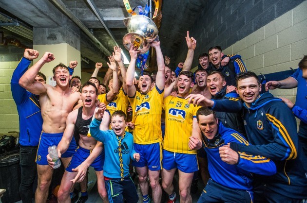 Roscommon celebrate after the game in the changing room with the trophy