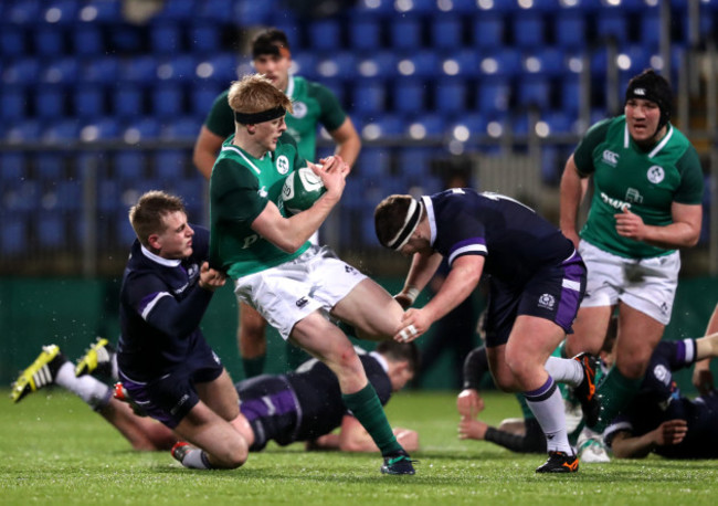 Tommy O'Brien tackled by Stafford McDowall and Bradley Clements