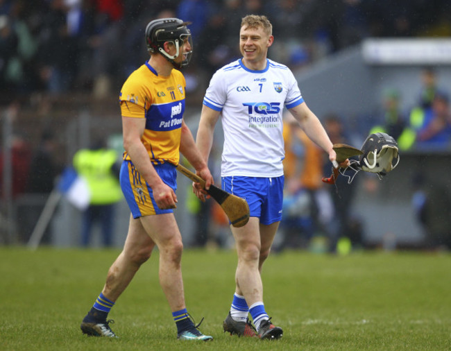 Waterford's Philip Mahony and Clare's John Conlon share a joke at the end of the game