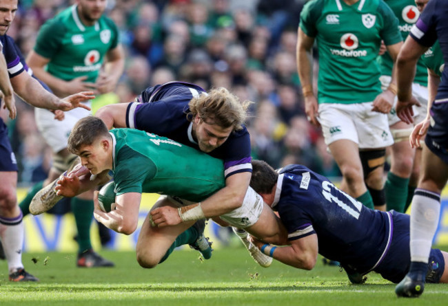 Garry Ringrose tackled by David Denton and Pete Horne