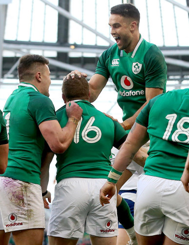 Conor Murray and Jacob Stockdale celebrate with Sean Cronin after he scored his sides bonus point try